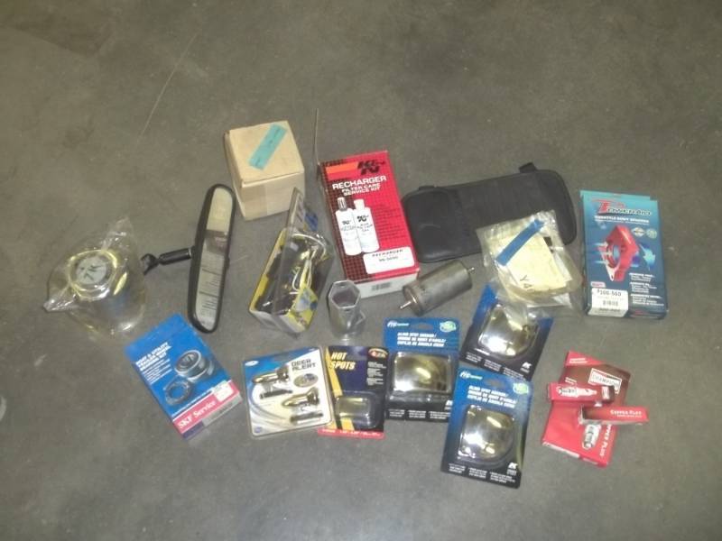 lot 208 image: Axle cap, blind spot mirrors, Dodge trailer wiring kit, boat trailer bearings, fuel filter, mirrors, spark plugs, air filter oil, etc