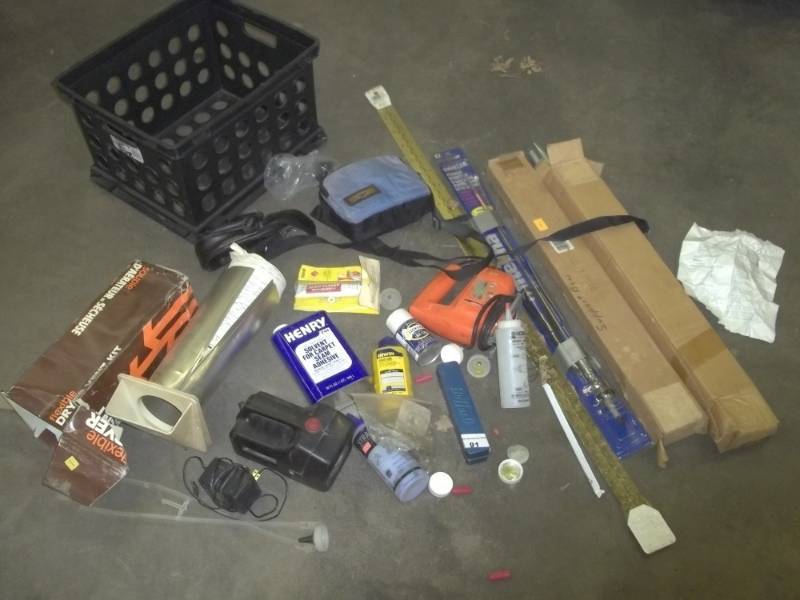 lot 239 image: CB antenna, tonnu cover bow supports, jigsaw, camera cases, seam sealer an black tote
