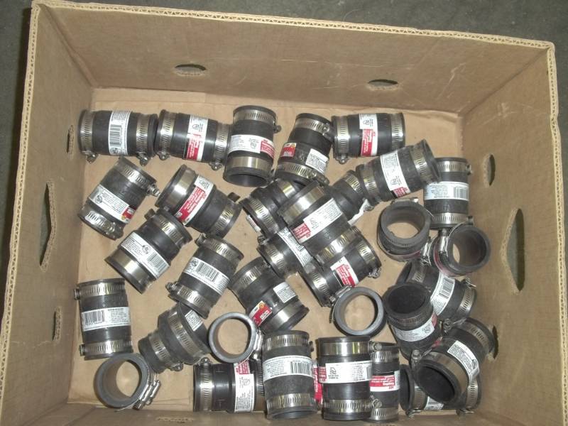 lot 245 image: 1  14 plastic or cast iron couplers and 1  12 to 1  14 plastic or cast iron couplers
