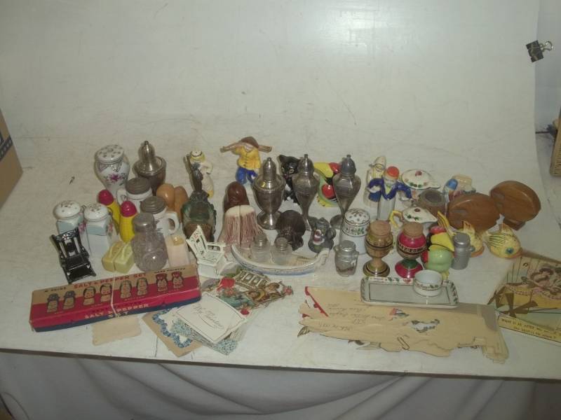 lot 270 image: Large assortment of salt and pepper shakers and post cards