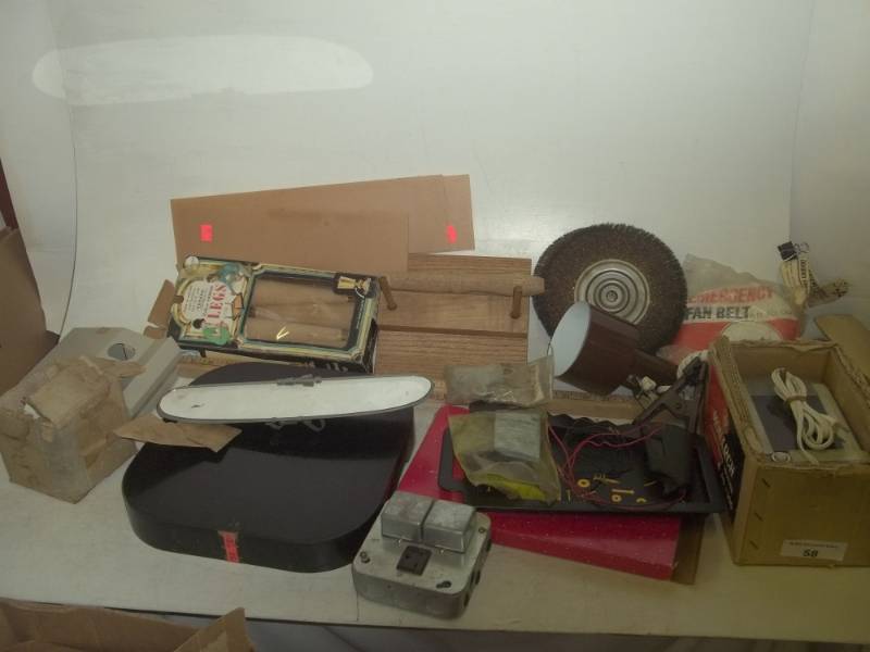 lot 318 image: Vintage emergency fan belt, wood legs, bolt tray, rearview mirror, wheel brush, plug in clamp light
