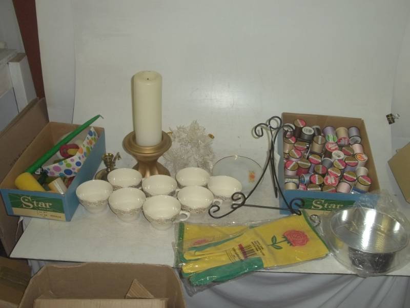 lot 324 image: Garden gloves, candle, candle holder, tea cups, picture holder, thread, plates, etc.