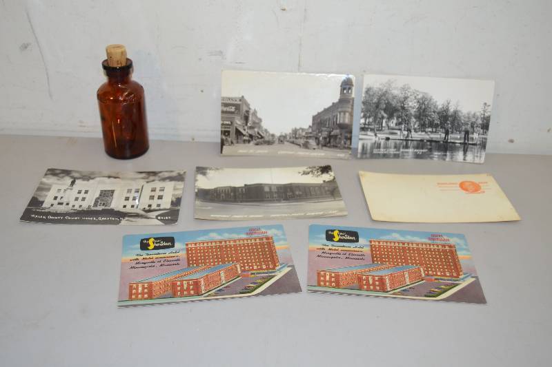 Vintage postcards and bottle