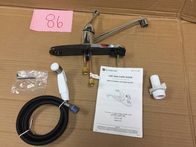 lot 86 image: Glacier Bay Single-Handle Standard Kitchen Faucet with White Side Sprayer in Chrome,open Box never been used Stock and actual photos used to display item