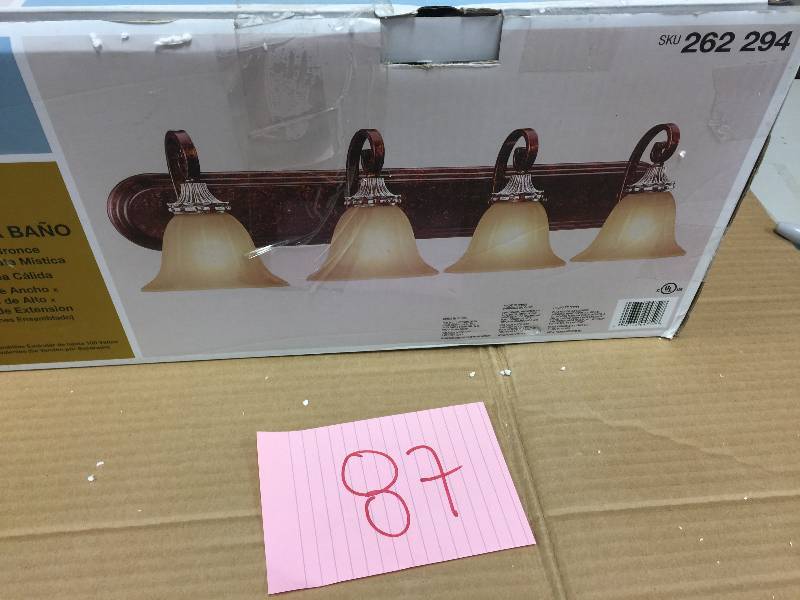 lot 87 image: Hampton Bay 4-Light Oxide Brass with Mystique Silver Bath Light, open Box never been used Stock and actual photos used to display item