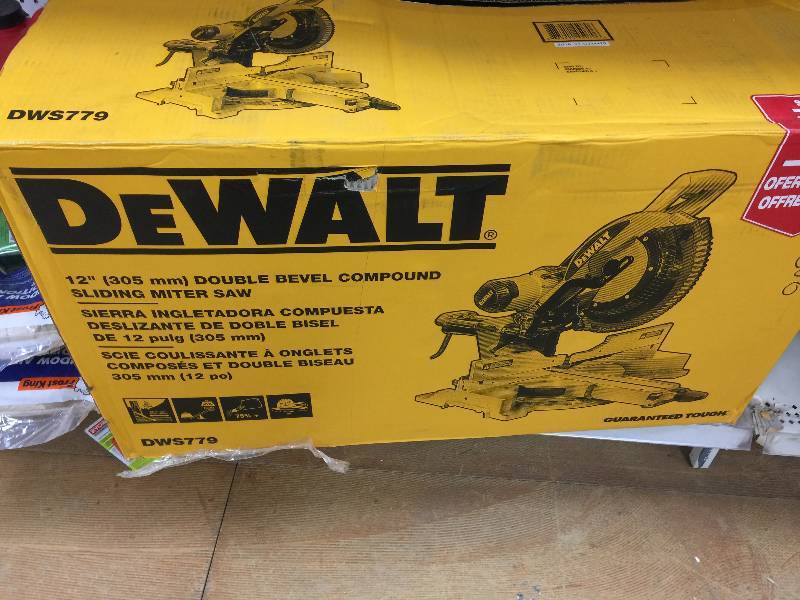 lot 102 image: DEWALT 15 Amp 12 in. Sliding Compound Miter Saw, open Box never been used Stock and actual photos used to display item
