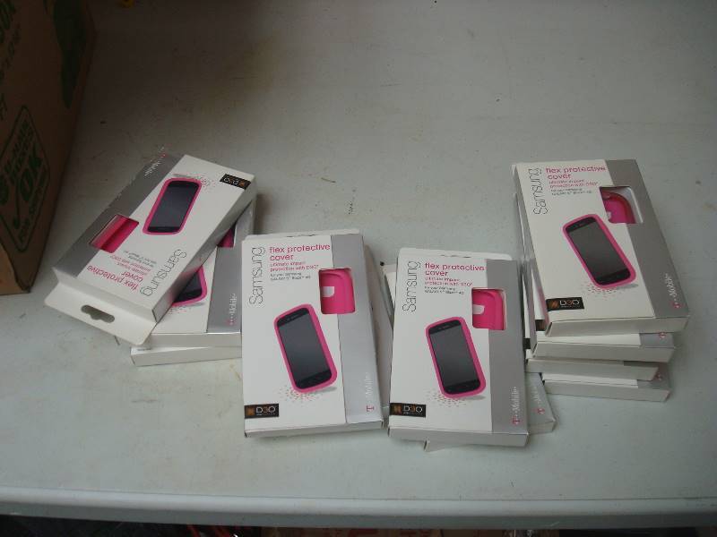 lot 79 image: Box Filled With Unused Pink Samsung Cell Phone Cover Cases, I Believe Around One Hundred