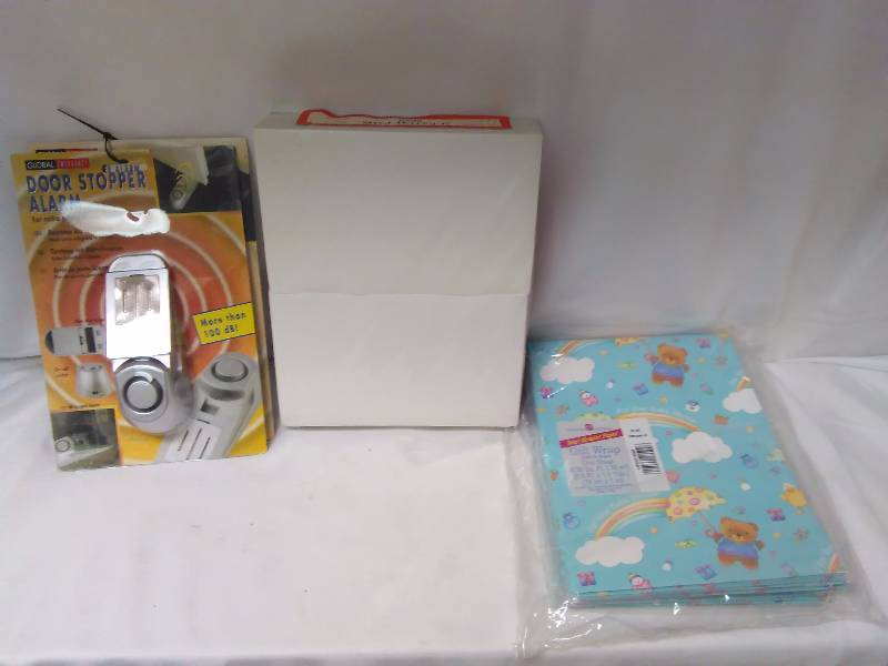Gift Wrap (9 pkgs.), note pads (12) and Door Stopper Alarms (2)