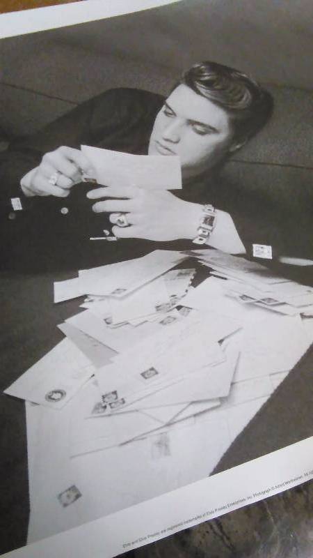 Elvis at 21 Reading Fan Mail Print, by Alfred Wertheimer.