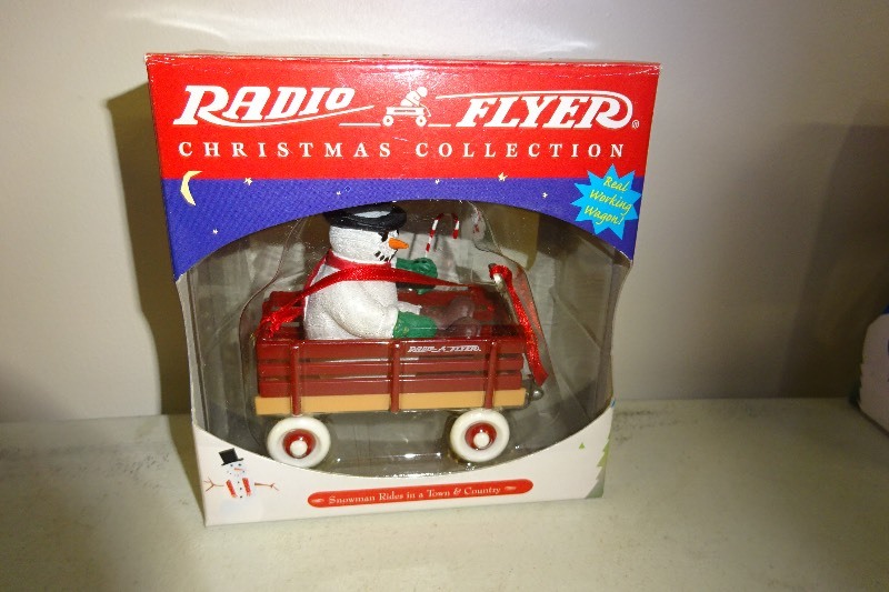 Radio Flyer Snowman Rides in town and country ornament