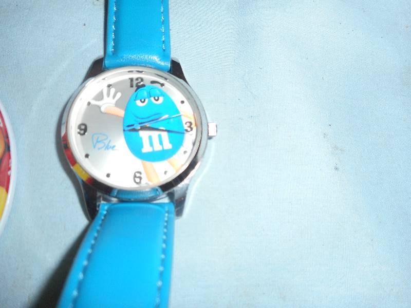 M AND M TIN AND WATCH