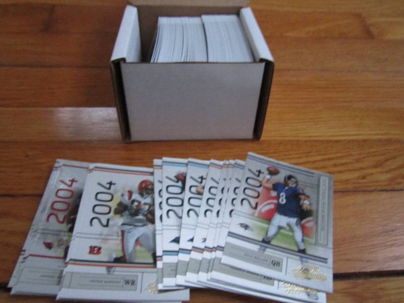 Box of 2004 leaf Certified football...