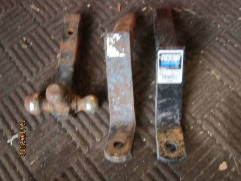 lot 38 image: 2 drop hitches and a 3 ball hitch...