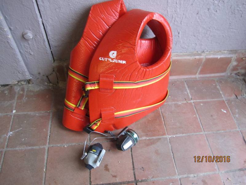 lot 40 image: Fishing reels and a lifevest...