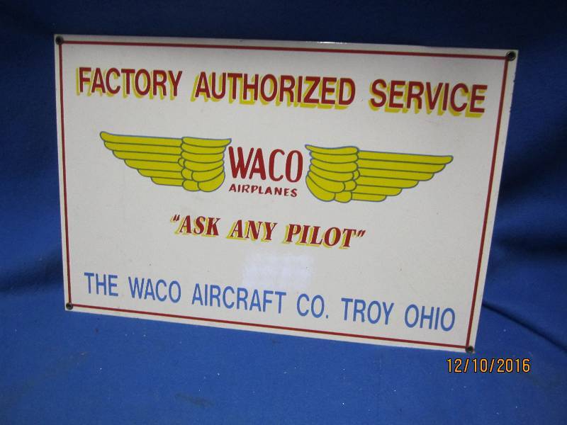 lot 9 image: Thick metal Waco Airplanes sign...