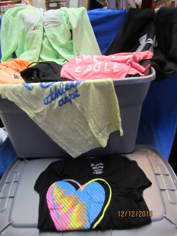 lot 71 image: Large plastic tote filled with clot...