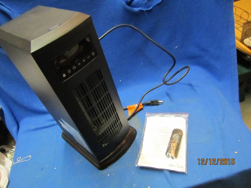 lot 85 image: Electric space heater with remote, ...