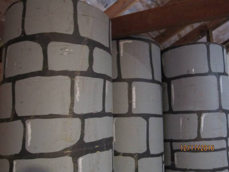 lot 105 image: 3 tall carbboard tubes painted like...