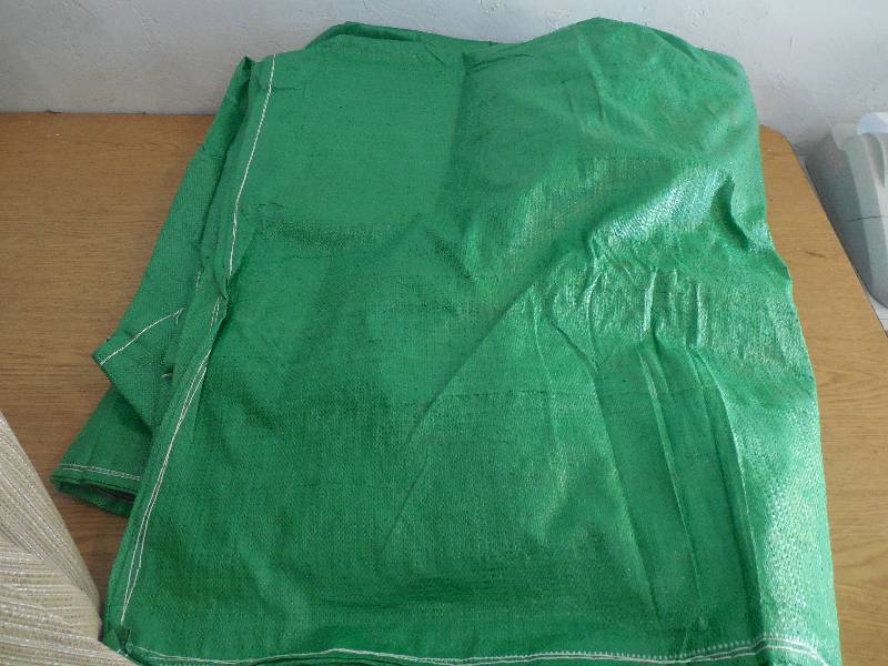 lot 11 image: PATIO UMBRELLA AND GREEN TARP