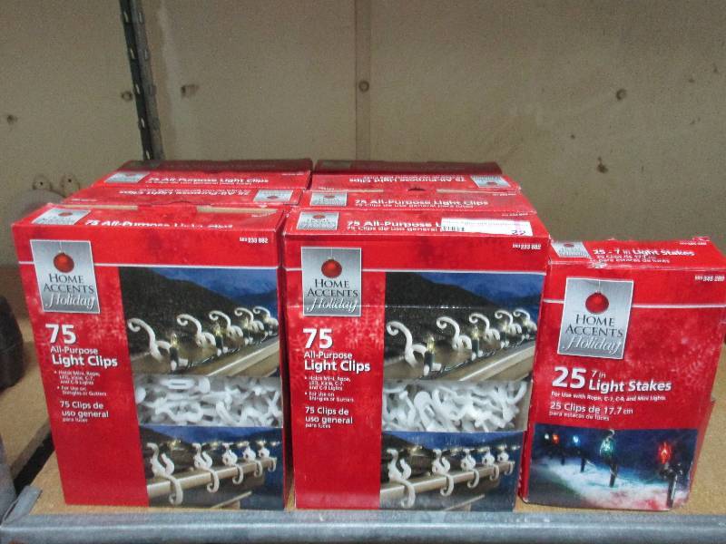 8 boxes of holiday light clips 1 box of 7 inch holiday light stakes