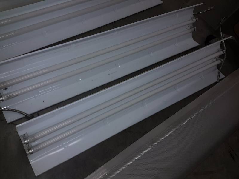 4, T8 type of 2 bulb fluorescent light fixtures.. With Plastic Covers
