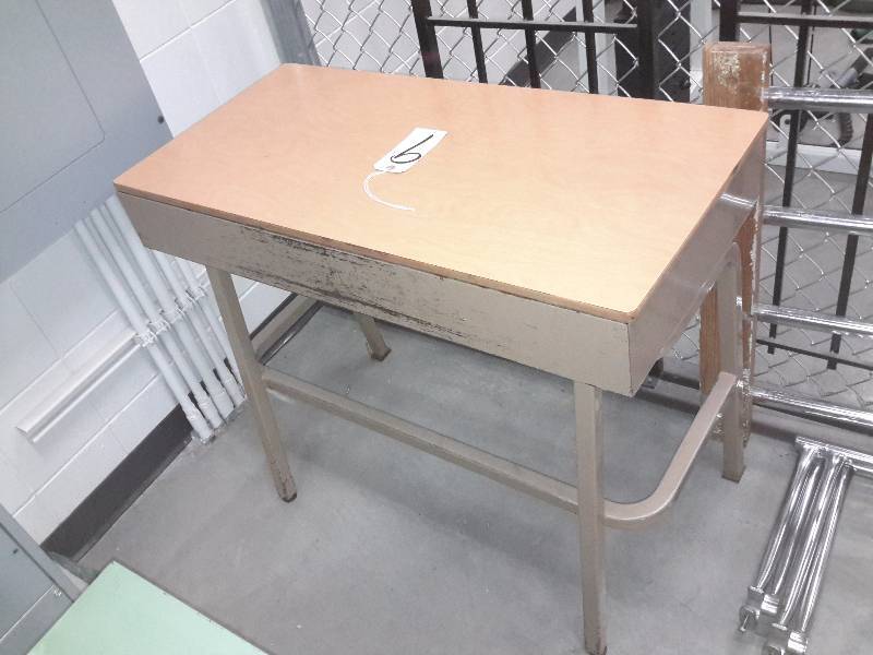 Simulated wood topped, metal frame desk with slide in compartment
