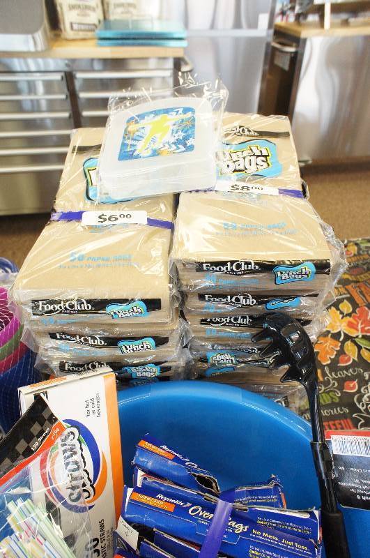 lot 42 image: Large Lot of New Assorted Kitchen Supplies - Glasses , Bowls, Sandwich Bags, Chip Clips, Tupperware, Oven Bags, Lunch Bags, and More