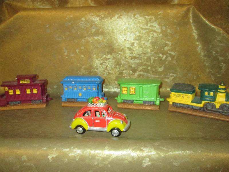 lot 235 image: Ceramic train and VW beetle...