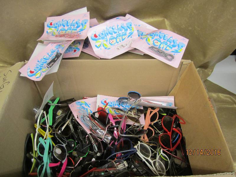 lot 87 image: Box of sunglasses and sunglass cord...