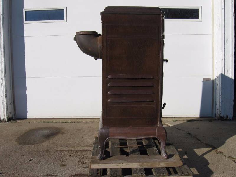 lot 14 image: Griswold Cast Iron Parlor Wood Stove