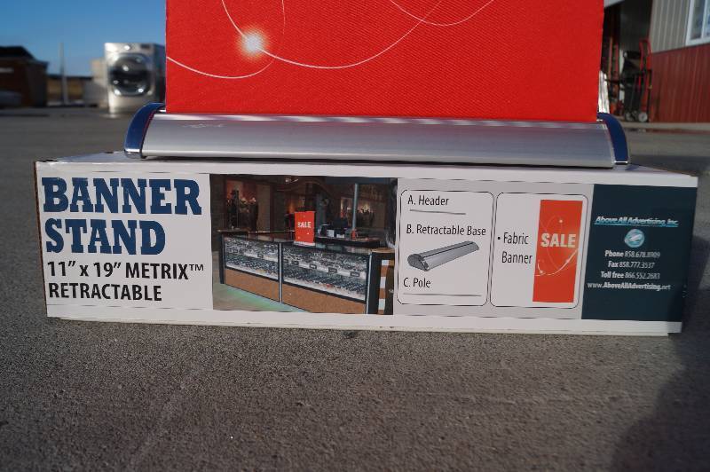 lot 18 image: Small Retractable Sale Banner Stand