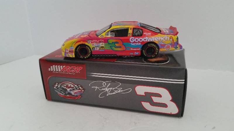 lot 28 image: 2004 Action Collectables 132nd 2000 Chevrolet Monte Carlo GM Goodwrench Service Plus Peter Max Paint Scheme