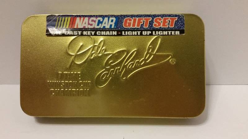 lot 22 image: Lot of Dale Earnhardt Collectables Pencills, Pens, Fridge Magnets, NASCAR Trivia Cards and Keychain and Lighter Set