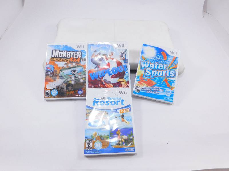 lot 12 image: Lot of 4 Wii Video Games  Wii Balance Board