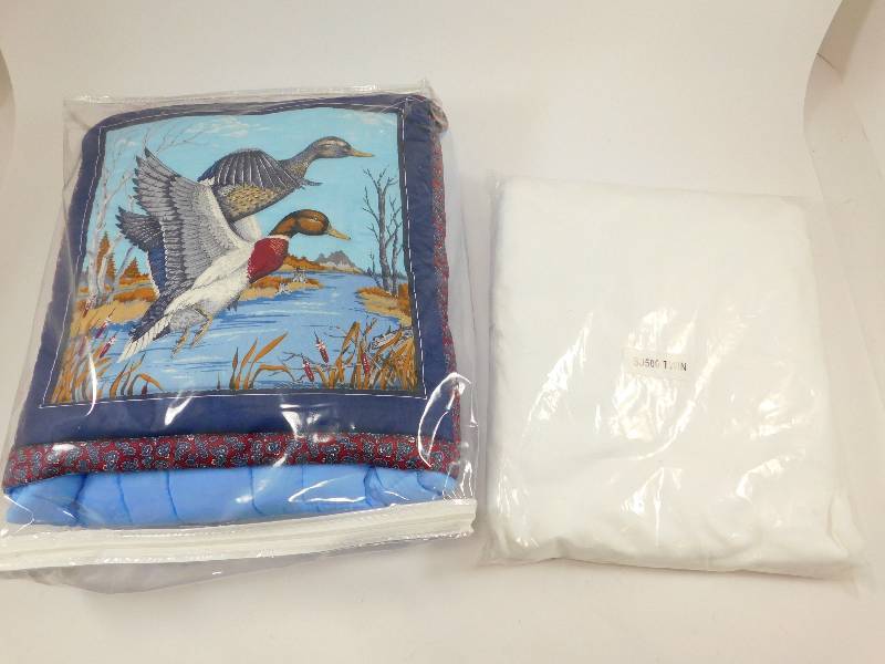 lot 30 image: New Quilt and Twin Size Mattress Cover