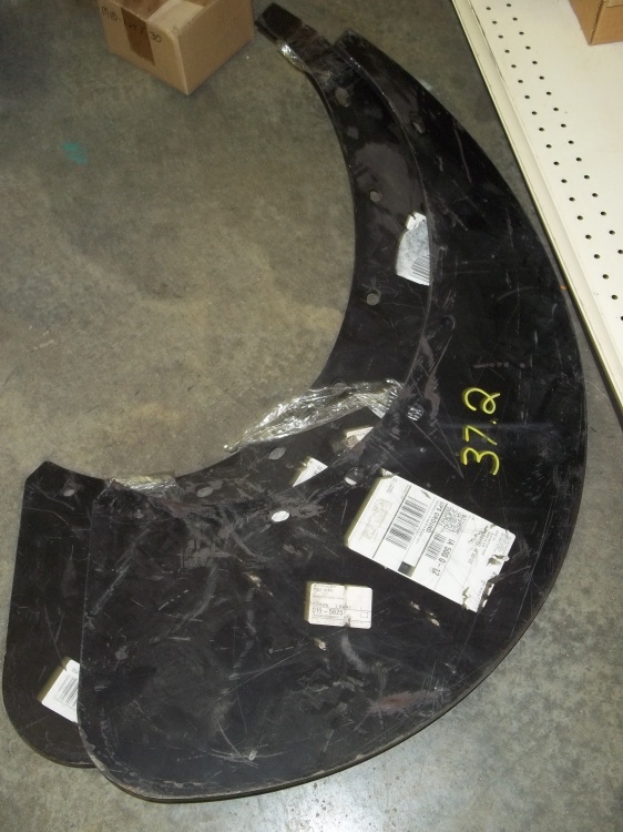 lot 43 image: Pair of heavy duty curves steel pieces (looks like plow curve)