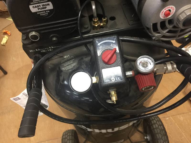 lot 74 image: Husky 30 Gal. 155 psi Ultra-Quiet Portable Electric Air Compressor, Model # C302H used in working condition need air filter and the tire are flat
