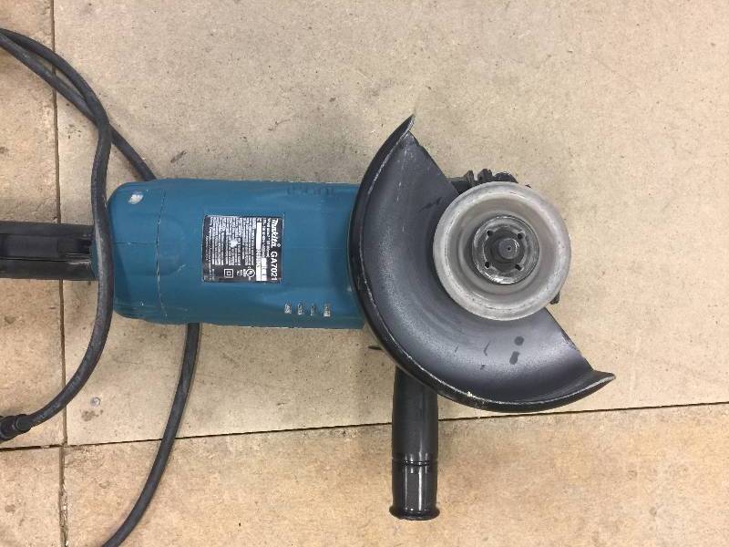lot 78 image: Makita 15 Amp 7 in. Corded Angle Grinder, Model # GA7021  used in working conditions