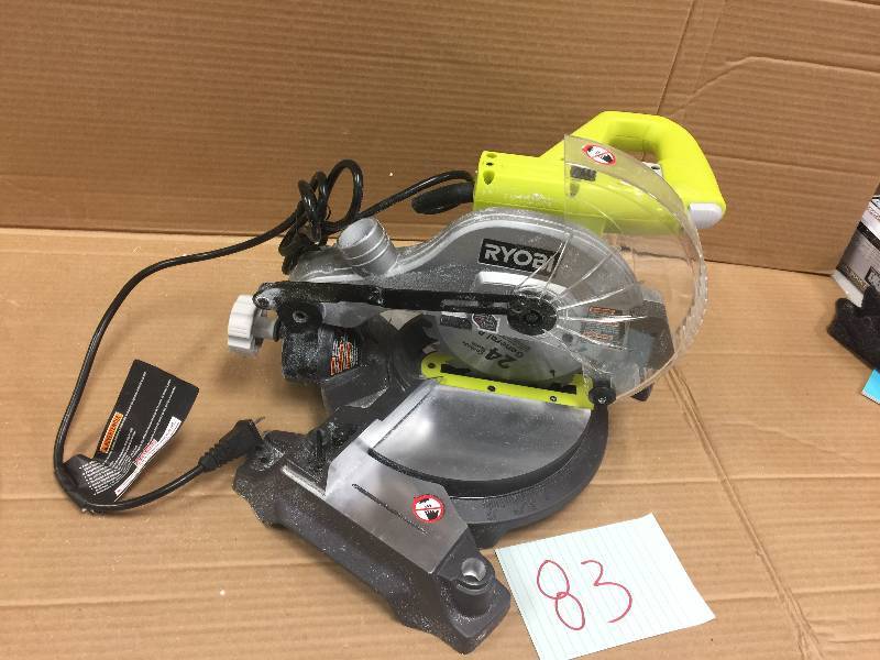 lot 83 image: Ryobi 9 Amp 7-14 in. Compound Miter Saw with Laser in like New working conditions mising the bag