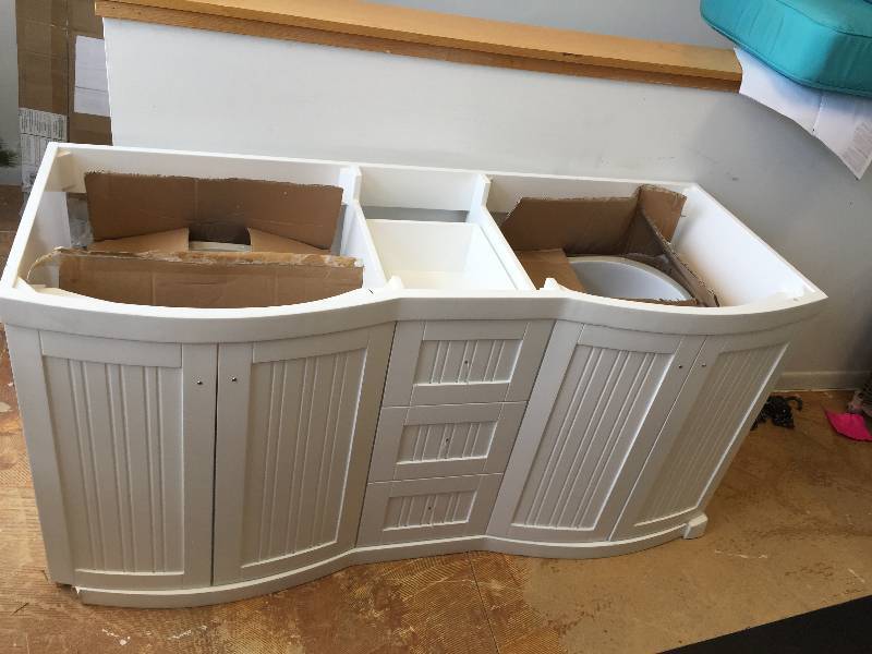 lot 119 image: Virtu USA Khaleesi 60 Bathroom Vanity Cabinet in White- Double Sinks and includes both sinks- it is missing the legs and drawer knobs