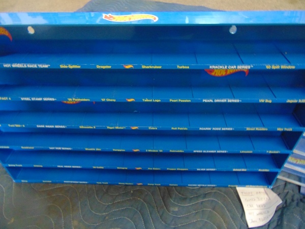 lot 178 image: (3) Mattel Issued Die Cast Car Racks and Hot Wheels Store Advertisment