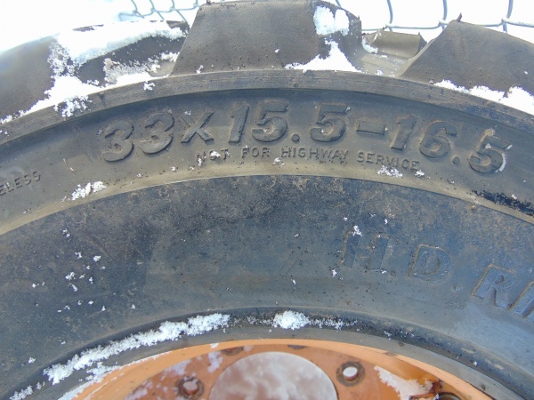 lot 179 image: Skid Loader Tire and Rim