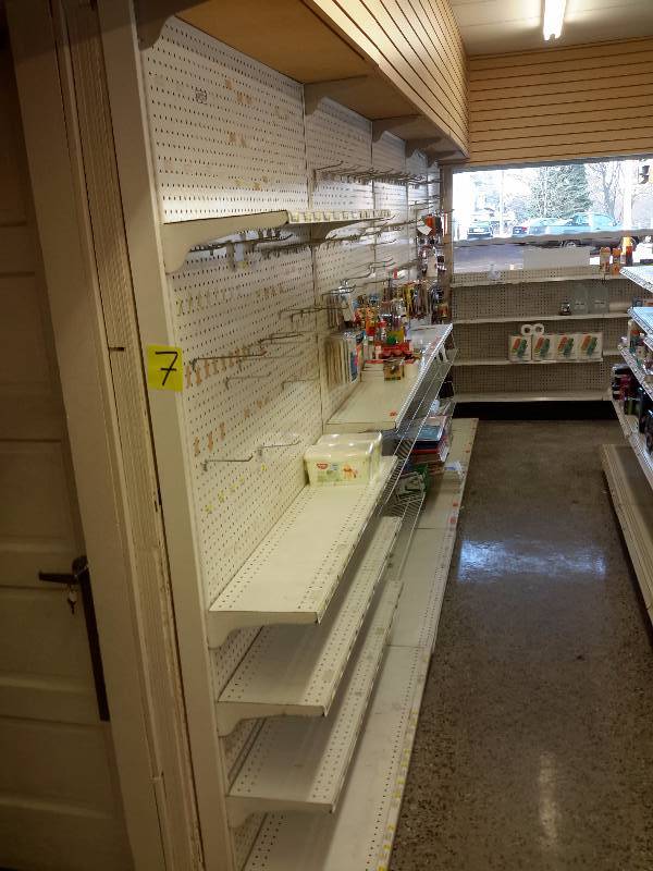 lot 7 image: 4, 48 in w display units with shelves and hooks as shown  3, 48 in wall shelves and hooks as shown.  More shelves available in lot