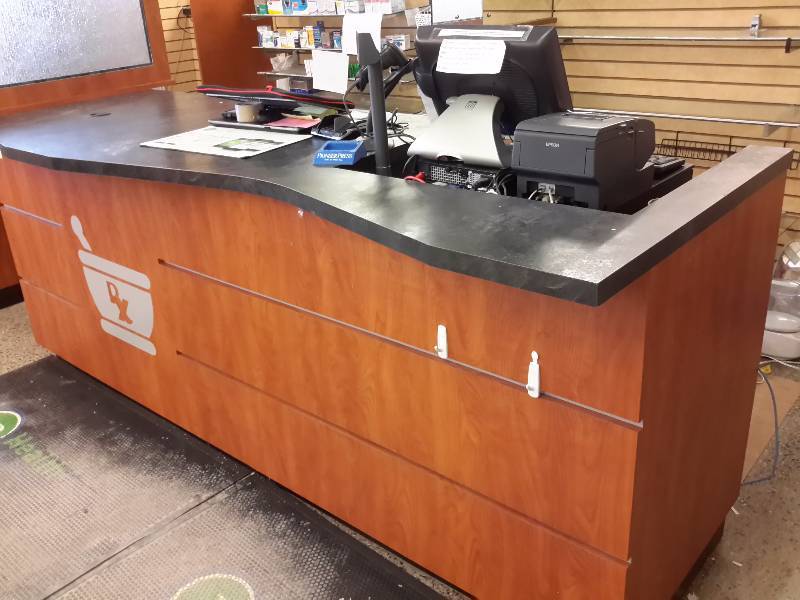 lot 6 image: Wood and laminate top Service counter as shown.  Approx 12 ft long.. 