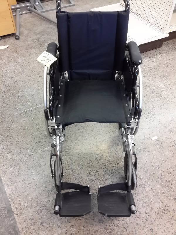 lot 34 image: Very nice Smaller Wheel Chair.. Approx 20 in w seat.. Folds