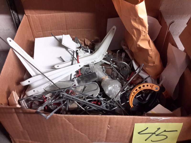 lot 45 image: Boxes of Misc. Pegboard and shelving hardware.. See closeups