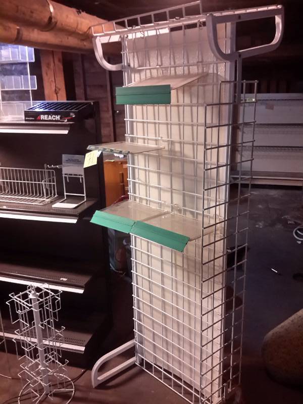 lot 71 image: 42 in w display shelf with 4 shelves.. Other free standing displays as shown