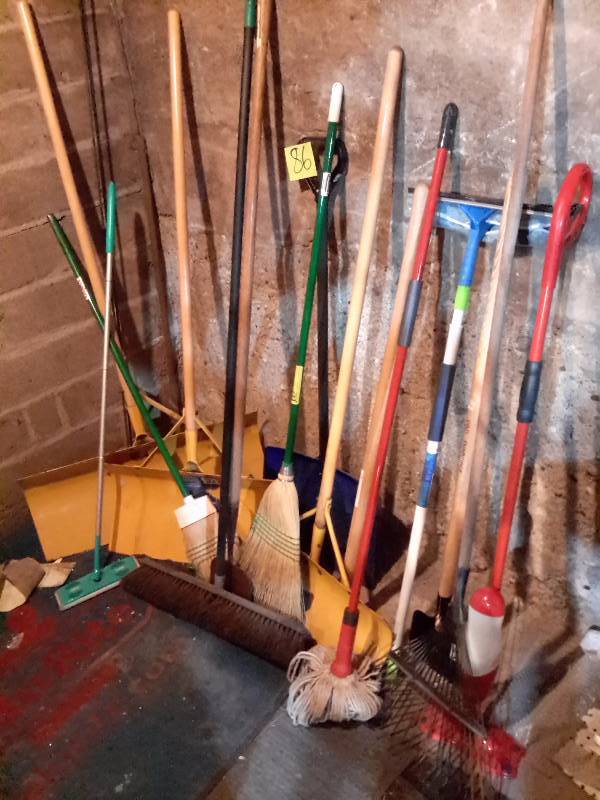 lot 86 image: Large lot of Shovels, rakes, brooms..Wooden Ladder and other tool items as pictured..