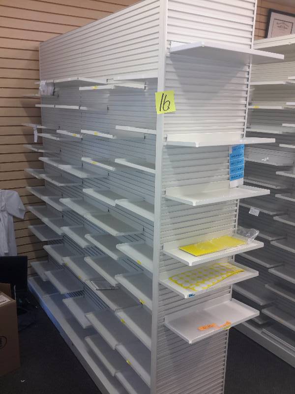 lot 16 image: Slatted wall shelving system as shown.. Look at diagram showing widths. 17 12 in end shelves on ends of 2, 2 sided walls