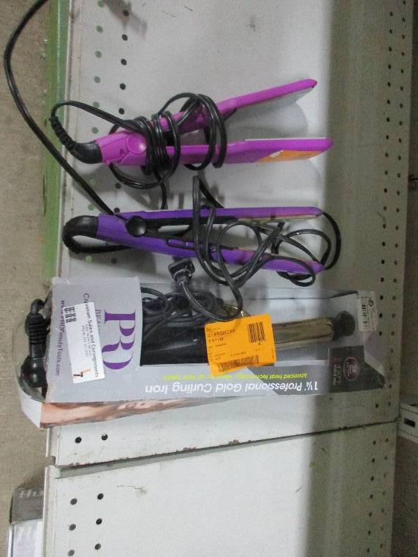 2 hair straighteners and 1 curling iron